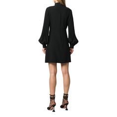 This black dress is detailed with a heart-shaped cut-out on the front.Band collarBillowing sleevesRear zip fasteningHeart motif cut-out detailMade in ItalyComposition: Viscose 70%, Acetate 27%, Spandex/Elastane 3%Lining: 73% Acetate, 27% Silk Made in Italy Gucci Fitted Dress For Night Out, Fitted Gucci Dress For Night Out, Chic Gucci Dress For Night Out, Gucci Long Sleeve Evening Dress, Gucci Black Evening Dress, Elegant Gucci Mini Dress For Party, Gucci Long Sleeve Formal Dress, Gucci Knee-length Cocktail Dress, Elegant Black Gucci Dress