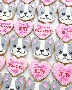 decorated cookies with dogs and hearts in the shape of heart - shaped dog's faces