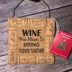 a wine cork door hanger with a christmas tree on it and a red tag