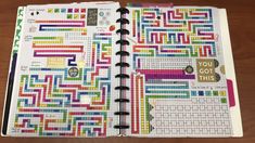 an open planner with lots of colorful stickers on the pages and some words written in it