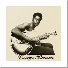 a man sitting down playing a guitar with the caption george baron on his chest