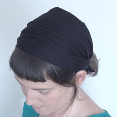 A wide headband  for women made of soft fabric. Super comfy on your head. The headband is a TIE ON headband, it is light weight and soft. A great gift for women, unique and in a limited edition. Comes nicely wrapped. The black fabric has tiny holes, visible on a light surface, creating a bit of an extra chic touch.  Why TIE ON headband? I make all of my headbands TIE ON since I find this the most comfy way to wear them, the stay on perfectly and don't feel tight on the head like often feels with elastic.   Colors Choose upon check up. Looking for a color that is not in the list? Right me I will gladly make it for you   size Headband width is approx. 30 cm 13 inch  Custom orders I do make custom orders. Please contact me for a specific color combo made just for you!  Shipping  The headband Stretch Headwrap With Matching Headband, Solid Color Headscarf Shaped As Headband, Black Headscarf In Headband Shape, Cotton Sweatband Headwrap, One Size Fits Most Headband Headscarf, Black Headwrap One Size Fits Most, Black One-size-fits-most Headwrap Headband, Black Headscarf With Matching Headband, Kerchief Headband