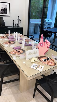 the table is set up with plates and napkins to look like they are making a hand gesture