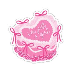 a pink heart shaped cake with bows on it's sides and the words, this is