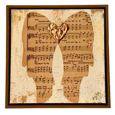 an old sheet music with two angel wings and musical notes on the sides, framed in brown