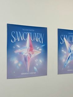 two posters are hanging on the wall next to each other in front of a white wall