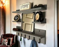 "Add a farmhouse rustic feel to your entryway with our entry coat rack & wall shelves. Optional Mirror measures 12\" x 12\". With a large top shelf and 2 small shelves on both sides of the mirror to display your favorite small plant, photos, or small farmhouse decor. Has 6 large hooks to hang your keys & coats. Can also be used in a mudroom, kitchen or laundry room. Made with solid wood. Wood stain available in English Chestnut, Espresso, True Black, Weathered Gray, Dark Bourbon or White Wash. C Entryway Mirror And Shelf, Mirror And Coat Hooks, Floating Shelves And Mirror, Small Farmhouse Decor, Coat Hooks Hallway, Modern Coat Rack Wall, Entryway Wall Shelf, Entry Coat Rack, Mudroom Kitchen