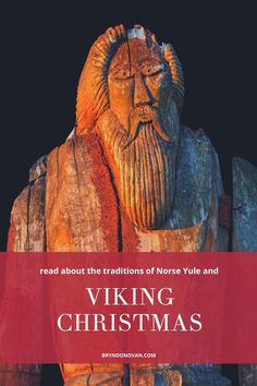 a wooden statue with the words viking christmas written in red and white on it's side