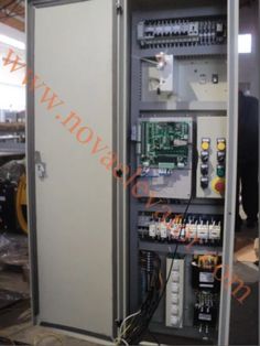 an electrical panel with wires and other equipment