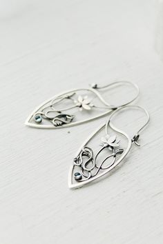 ITEM DESCRIPTION: Size H 6 x W 2 cm (2 1/2 x 2/3 inches) with closure. Wire earrings are very lightweight and comfortable for your ears. Weight - 4 g of each other. I made these hoop earrings of sterling silver and topaz swiss. The lotus flower and the shape of earrings are so elegant and unusual. They will be the best addition to your jewelry collection and will bring you many compliments. This is a really unique and valuable thing. I have some amazing jewelry with a lotus flower in my Etsy sho Artistic Sterling Silver Teardrop Earrings, Artistic Teardrop Sterling Silver Jewelry, Artistic Sterling Silver Teardrop Jewelry, Sterling Silver Art Nouveau Jewelry, Artistic Teardrop Silver Jewelry, Artistic Silver Teardrop Jewelry, Hammerhead Shark Necklace, Elven Jewelry, Shark Necklace