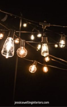 some lights that are hanging from a wire