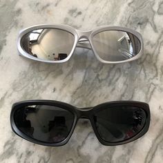 Sunglasses: Metallic, Black Brand New, Never Worn Selling Both For $12 Total Silver Mirrored Shield Sunglasses For Outdoor, Casual Silver Shield Sunglasses With Uva Protection, Casual Silver Shield Sunglasses With Tinted Lenses, Trendy Silver Shield Sunglasses For Outdoor, Casual Silver Cat Eye Sunglasses, Casual Silver Shield Sunglasses With Mirrored Lenses, Colored Sunglasses, Black Silver, Sunglasses Accessories