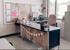 an office with a desk, chair and filing cabinets in it's center area