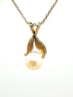 Gentle Vintage 14K Yellow Gold White Pearl Floral Crarm Pendant  A perfect gift for your loved one for any special occasion or holiday!  Total Pendant Weight: 1.51g Pendant Length: 19.83mm Pendant Width: 9.36mm Necklace not included. There is an additional charge of $150 if necklace is needed.  Item will be placed in a gift box. * Classic Yellow Gold Jewelry With Hallmark, Classic Formal Jewelry With Hallmark, Elegant Gold Necklace With Hallmark, Elegant 14k Gold Necklace With Hallmark, Elegant Jewelry With Hallmark For Wedding, Elegant Hallmark Jewelry For Wedding, Gold Hallmark Jewelry For Formal Occasions, Formal Gold Jewelry With Hallmark, Elegant Hallmarked Jewelry