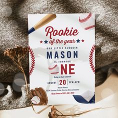 a baseball themed birthday party is set up on a couch with the theme of rocket of the year