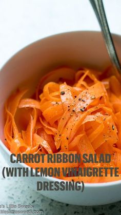 carrots in a white bowl with the words carrot ribbon salad with lemon vingrette dressing