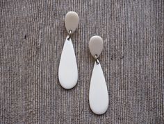 This beautiful earrings pair is handcrafted from natural bone material. Natural bone has off-white color. Dimension: 6 x 1.5 cm. Finish: polish. Metal Parts: stainless steel L306. Have a happy shopping time! See you again soon! With kindest regards, MosaiK Horn Pendant Necklace, Horn Earrings, Bone Earrings, Horn Pendant, Loop Earrings, Off White Color, Happy Shopping, Bones, Beautiful Earrings