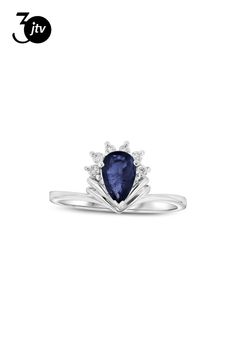 a white gold ring with an oval blue sapphire and diamonds