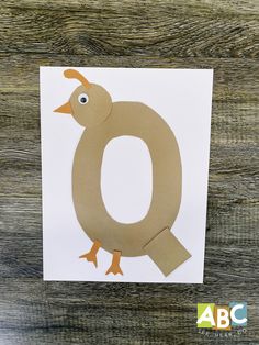 the letter o is made out of paper with an image of a duck on it