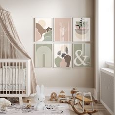 a baby's room with several pictures on the wall and toys in the floor