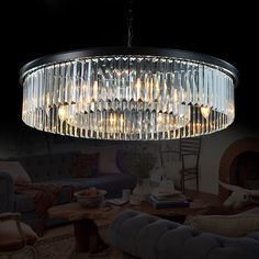 a chandelier hanging from the ceiling in a living room