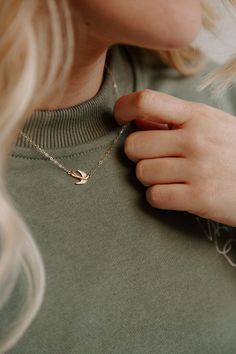 The WCC Swallow Necklace features a delicate 14k gold filled chain and pendant. Our charming swallow bird design, reminds us of the birds of the air mentioned in Matthew 6, leading up to our favorite verse Matthew 6:33. With its dainty design this necklace adds a subtle touch of elegance to any outfit. Elevate your sty Gold Necklace With Bird Design As Gift, Gold Swallow Necklace, Gold Pendant Necklace With Bird Design, Silver Dove Necklace, Gold Bird Necklace, Swallow Necklace, Miraculous Medal Necklace, Catholic Bracelet, Matthew 6 33