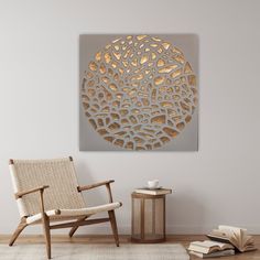 a white chair sitting next to a wooden table on top of a hard wood floor