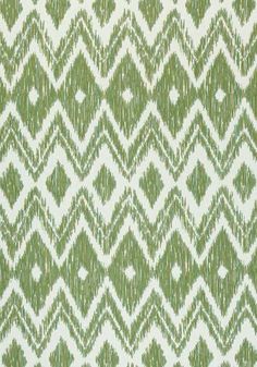 a green and white pattern on fabric