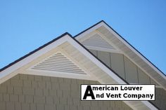 an american louver and vent company logo on the side of a house with a blue sky in the background