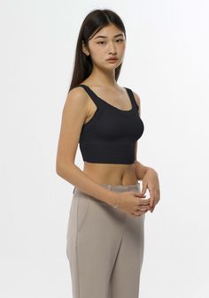 Soft and fitted crop top with scoop neckline. High Stretch Crop Top With Built-in Bra, Fitted Crop Top With Built-in Bra And Scoop Back, Fitted Seamless Crop Top, Chic Scoop Neck Crop Top With Built-in Bra, Casual Crop Top With Medium Bust Support, Cropped Tank Top With Medium Bust Support, Casual Crop Top With Built-in Bra And Scoop Neck, Casual Scoop Neck Crop Top With Built-in Bra, Black Scoop Neck Crop Top Bra Friendly