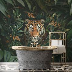 a bathroom with a tiger mural on the wall and a claw foot tub in front of it