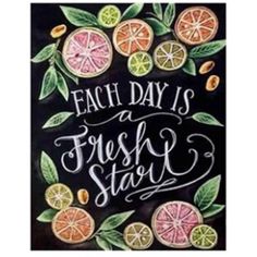 a chalkboard sign that says each day is a fresh start with fruits and leaves