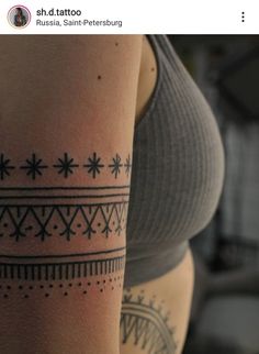 a woman with a tattoo on her arm