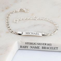 ♥ This 925 sterling silver baby name bracelet is the perfect customized gift for a new baby. The laser-engraved bar bracelet is designed specifically for kids, with a personalized option of back engraving. This kid's bracelet is handmade with high-quality sterling silver and features a unique silver chain. The endless customization options allow you to choose the perfect name and hidden message to make this bracelet a special gift for a baby girl. ♥ S I Z E  &  M A T E R I A LS: ★ STYLE: Kids Na Sterling Silver Nameplate Bracelet For Everyday, Everyday Sterling Silver Nameplate Bracelet, Adjustable Sterling Silver Name Bracelet With Engraving, Adjustable Engraved Name Bracelet In Sterling Silver, Adjustable Sterling Silver Name Bracelet Engraved, Customizable Classic Sterling Silver Name Bracelet, Classic Customizable Sterling Silver Name Bracelet, Classic Personalized Nameplate Bracelet, Classic Sterling Silver Custom Name Bracelet