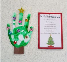 a green handprinted christmas tree next to a paper card with the poem i'm a little christmas tree