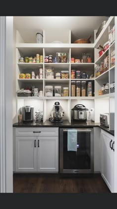 a kitchen with white cabinets and black counter tops is shown in this instagramtion