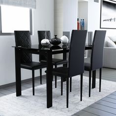 a black table and chairs in a room