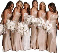 the bridesmaids are all wearing different styles of dresses