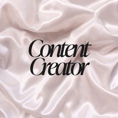 the word content creator is written on a white satin background