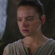 a woman in a star wars outfit looking at the camera with an angry look on her face