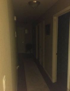 an empty hallway leading to another room