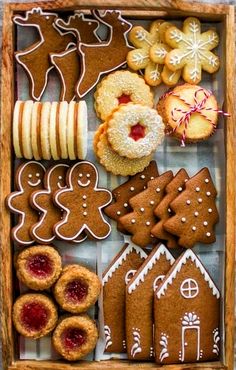 a wooden box filled with lots of different types of cookies