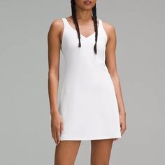 New With Tags Lululemon Align Dress White Get The Buttery Softness Of Lululemon Align In A Dress. Powered By Nulu Fabric And Made With A Built-In Shorts Liner, Your Poses And Postures Have Never Felt This Free. Designed For Yoga And Casual Feels Buttery-Soft And Weightless, Nulu Fabric So Buttery Soft, It Feels Weightless Four-Way Stretch Sweat-Wicking Breathable Added Lycra Fibre For Stretch And Shape Retention Medium Support Sizes 0-14 Fit B/C Cups Tight Fit Contours Your Body Intended To Sit Sporty White V-neck Dress, Spring V-neck Athleisure Dresses, Align Dress, Lululemon Align, Dress White, Lululemon Athletica, New Dress, Built In, White Dress