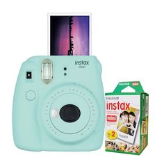 an instax camera next to its box