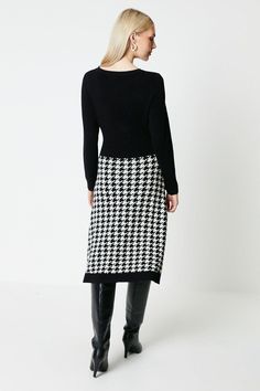 This dress features a timeless black and white checkered pattern, adding a touch of sophistication to any outfit. The midi length and knitted fabric provide comfort and warmth, making it perfect for both casual and formal occasions. Knitted Midi Dress, Leather Jacket Dress, Work Wear Outfits, Floral Shirt Dress, Tshirt Skirt, Knit Midi, Knit Midi Dress, Checkered Pattern, Shirt Skirt