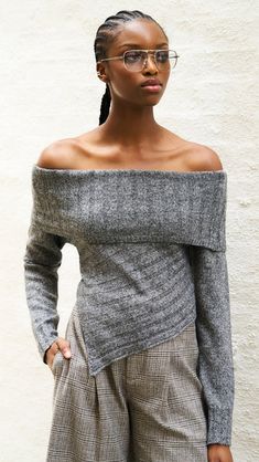 Add a touch of flair to your wardrobe with the Betty Sweater in Charcoal Grey. This cozy knit sweater features a unique silhouette that will wrap you in warmth and comfort. Perfect for layering or wearing alone, the Betty Sweater is a must-have for... Cozy Fitted Knit Top For Fall, Gray Knit Top For Fall, Gray Textured Knit Top For Fall, Fitted Knit Wrap Sweater, Gray Knit Top For Fall Layering, Trendy Knit Wrap Sweater, Chic Soft Knit Sweater For Layering, Chic Knitted Tops For Layering, Knit Tops For Layering In Winter