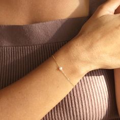 Dainty and classic, our Aura tiny pearl bracelet is a beautiful piece to wear everyday. Simple and timeless, you can wear it with everything. P R O D U C T * D E T A I L S - Pearl measures approximately 3.5mm - Available in Sterling Silver, 14k Gold Filled and 14k Rose Gold Filled - Each freshwater pearl is unique meaning the size and shape may vary - Wire wrapping detail - Available in Sterling Silver, 14k Gold Filled and 14K Rose Gold Filled L E N G T H - This bracelet is measured opened from Rose Gold Minimalist Pearl Bracelet For Everyday, Everyday Rose Gold Minimalist Pearl Bracelet, Minimalist Rose Gold Pearl Bracelet, Dainty Pearl Chain Bracelet With Jubilee Style, Dainty Rose Gold Bracelet With Pearl Charm, Rose Gold Dainty Bracelets With Pearl Chain, Dainty Rose Gold Bracelets With Pearl Chain, Elegant Tiny Pearl Jewelry, Dainty Pearl Charm Bracelet For Everyday Wear