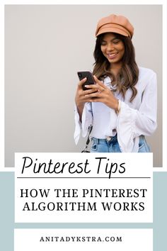 a woman wearing a hat and looking at her cell phone with the text pinterest tips how the pinterest algorithm works