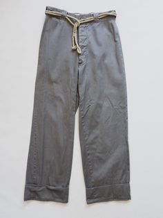 Era : 40's Origin : USA Fabric: Cotton Size : Waist width : 28” Hips width : 21" Rise : 12" Inseam : 30" without cuff Rope Belt Sold Separately ( Shop Here ) Vintage Relaxed Fit Tapered Leg Work Pants, Vintage Bottoms With Pockets And Straight Hem, Vintage Straight Leg Relaxed Fit Pants, Vintage Relaxed Fit Straight Leg Pants, Classic Wide Leg Selvedge Pants, Classic Selvedge Wide Leg Pants, Vintage Relaxed Fit Pants For Work, Selvedge Cotton Bottoms For Work, Selvedge Bottoms With Relaxed Fit For Workwear