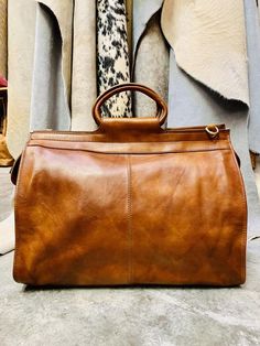 Chic Travel Satchel With Brass Hardware, Luxury Cognac Weekender Bag For Everyday, Chic Satchel With Brass Hardware For Travel, Leather Weekender Bag For On-the-go, Timeless Fall Travel Bags, Timeless Shoulder Bag For Travel In Fall, Everyday Bags With Brass Hardware For Fall, Top Handle Satchel With Brass Hardware For Travel, Luxury Everyday Cognac Duffle Bag